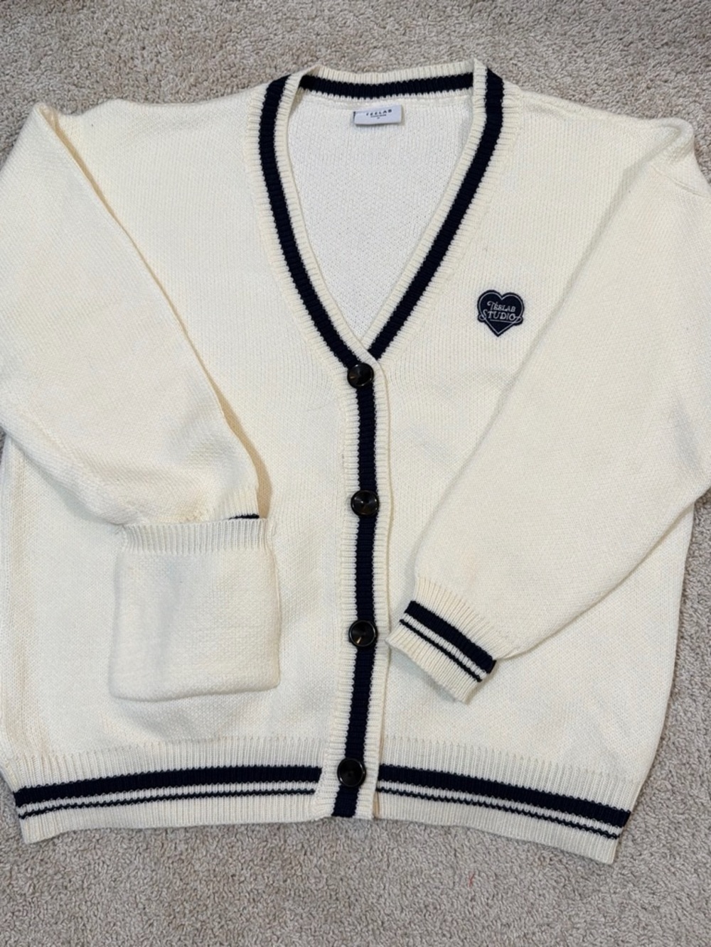 Studio Cream V-Neck Cardigan with Navy Trim and Heart Patch